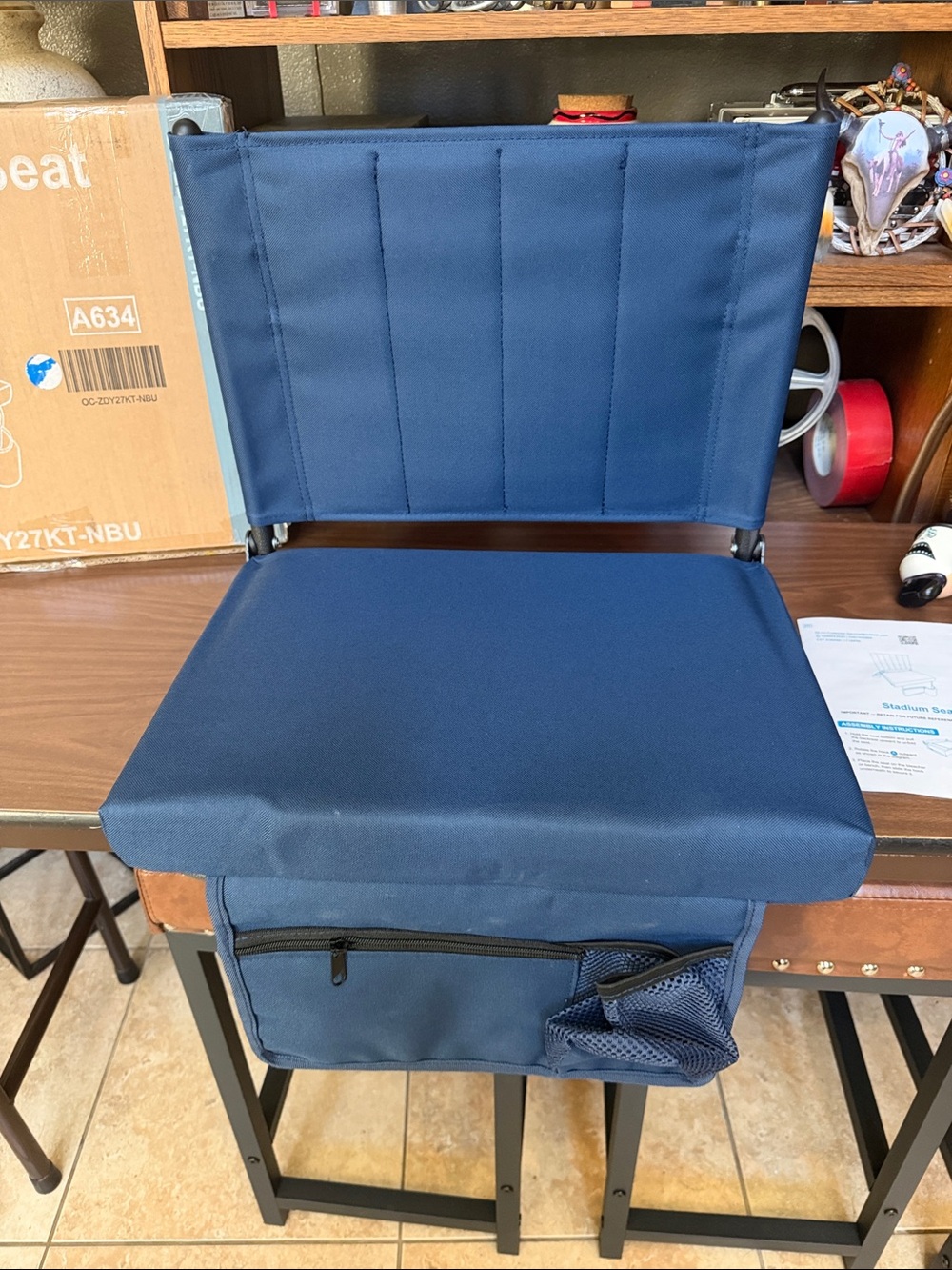 NIB Stadium Seat Navy Blue with carry strap, cup holder and zippered storage.